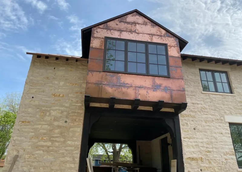 Copper metal panel facade on a stone building for Metal Roof Coating in Napili-Honokowai