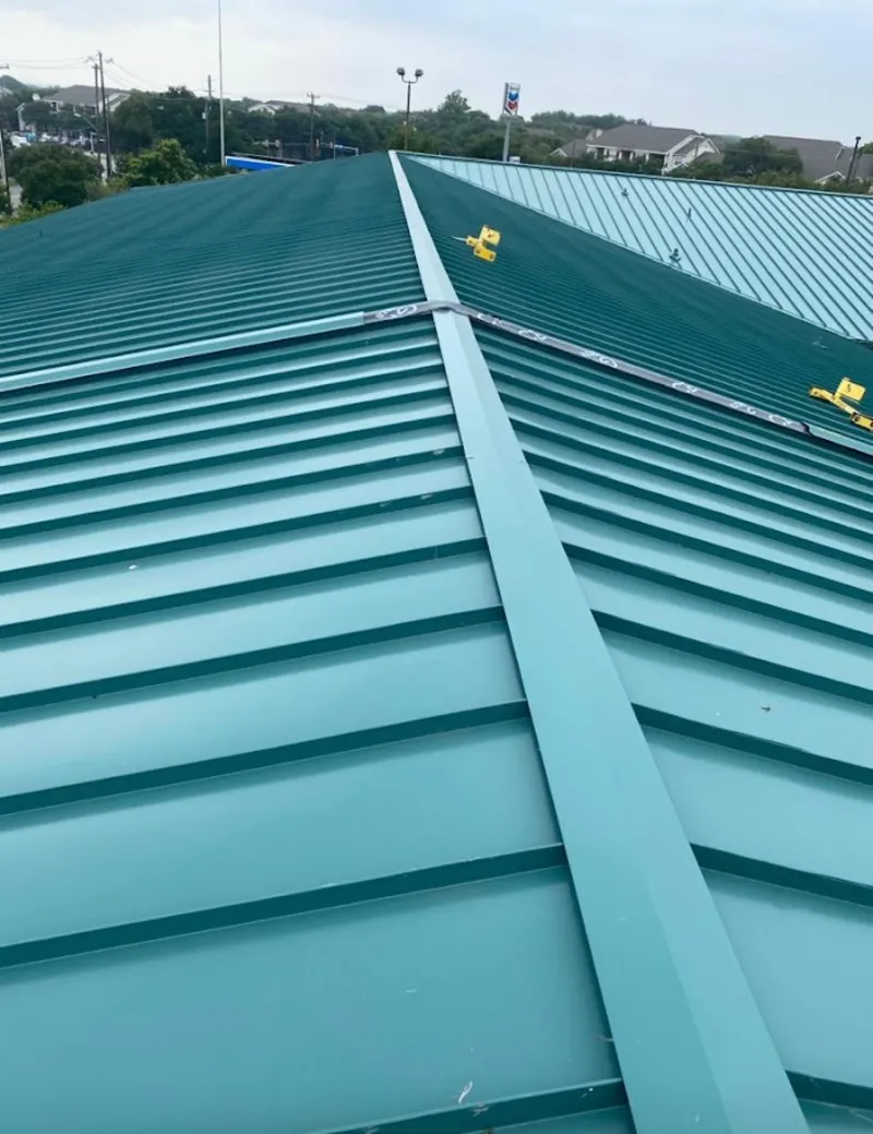 Green commercial metal roof ridge and valley for Metal Roof Repair in Napili-Honokowai