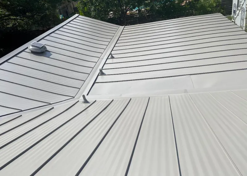 Solar attic fan installed on a metal roof for Roof Ventilation in Napili-Honokowai
