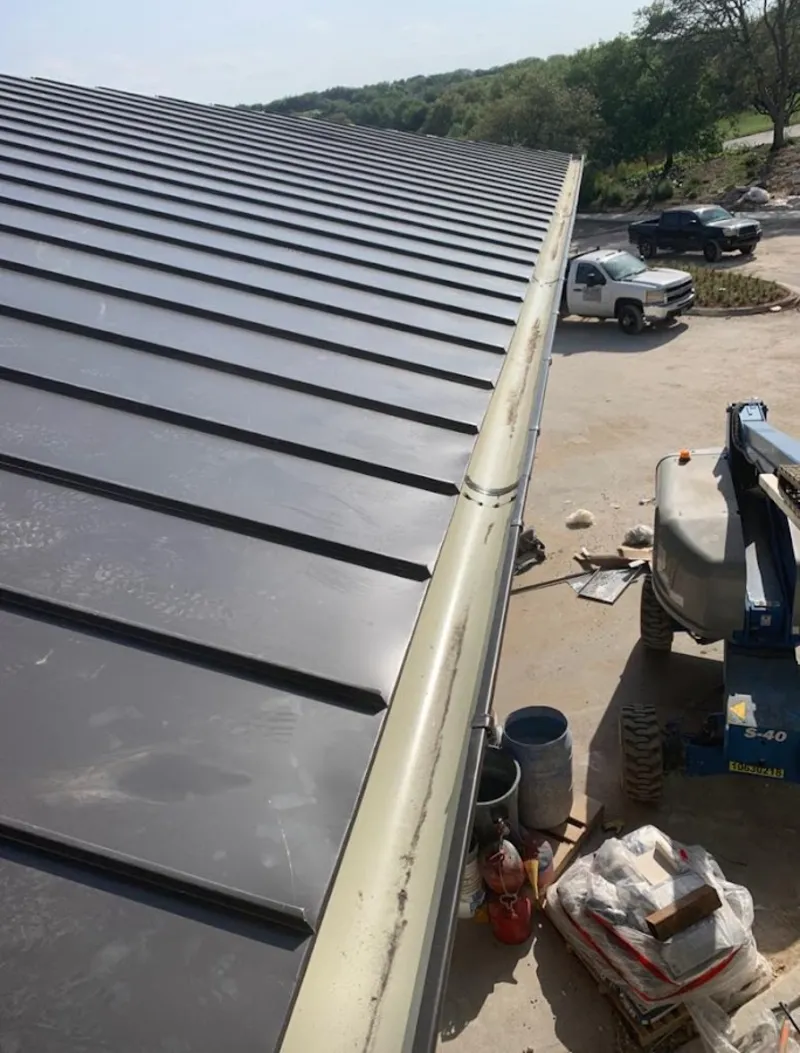 Standing seam panel and gutter detail on a metal roofing jobsite in Napili-Honokowai